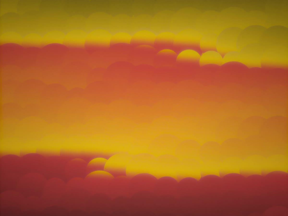 Bands of yellow, orange and deep red running across the frame, broken into rows of overlapping soft-edged lenses so the horizon reads as a torn edge.
